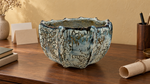 AI-generated setting : Ribbed bowl — blue-grey and brown markings, scene 2.